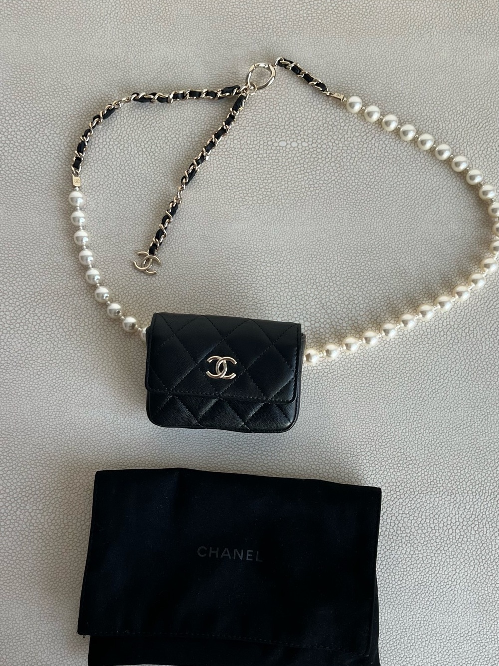 CHANEL Black Quilted Mini belt Bag with Pearl Chain